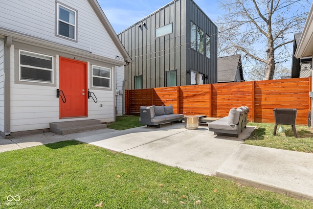 358 Terrace Ave, Indianapolis, IN 46225 - view of front of property featuring a fenced backyard, a patio, an outdoor living space, and entry steps