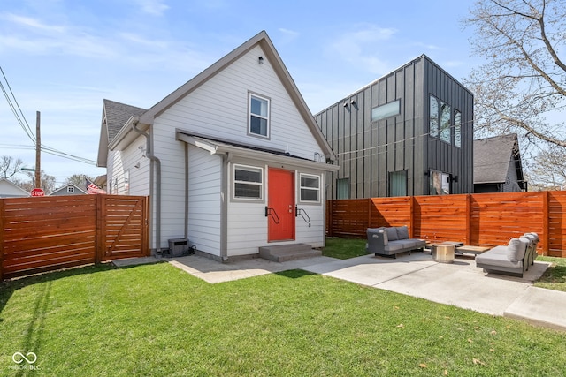 358 Terrace Ave, Indianapolis, IN 46225 - rear view of property featuring a yard, a fenced backyard, entry steps, and a patio area