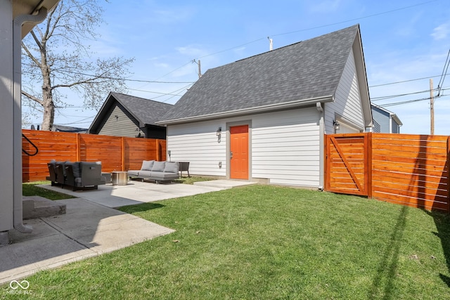 358 Terrace Ave, Indianapolis, IN 46225 - back of property featuring a patio, a fenced backyard, outdoor lounge area, a lawn, and a shingled roof