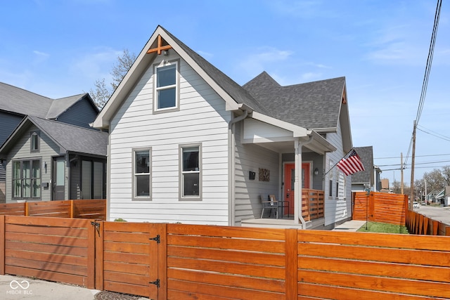 358 Terrace Ave, Indianapolis, IN 46225 - view of front facade featuring a shingled roof, a gate, and a fenced front yard