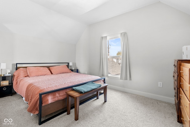 358 Terrace Ave, Indianapolis, IN 46225 - bedroom with baseboards, lofted ceiling, and light carpet