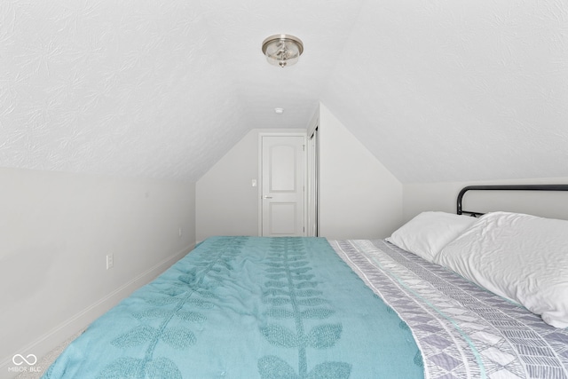 358 Terrace Ave, Indianapolis, IN 46225 - bedroom featuring baseboards, lofted ceiling, and a textured ceiling