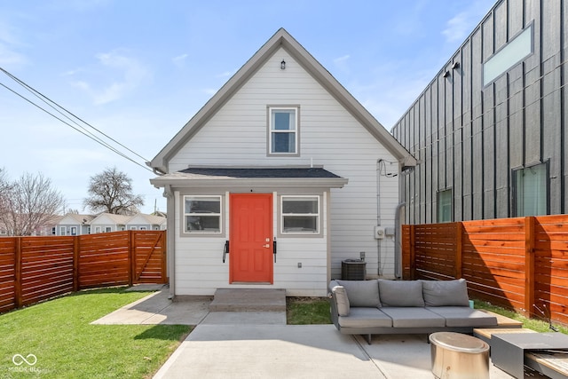 358 Terrace Ave, Indianapolis, IN 46225 - rear view of house featuring cooling unit, roof with shingles, a patio, a fenced backyard, and an outdoor living space