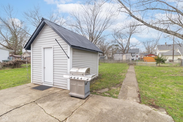 view of shed featuring fence