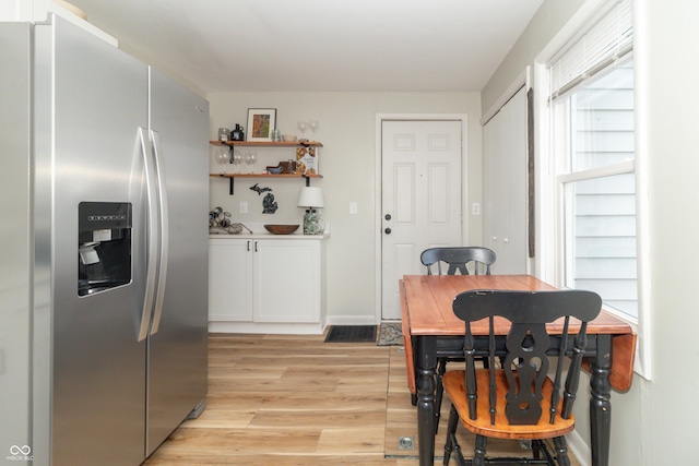 dining room with light wood-style flooring