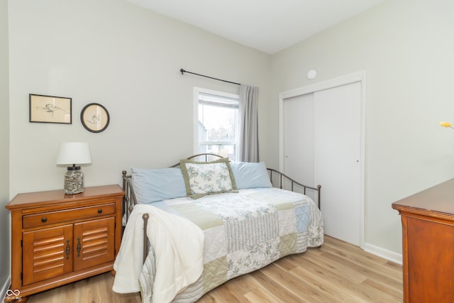 bedroom featuring a closet and wood finished floors