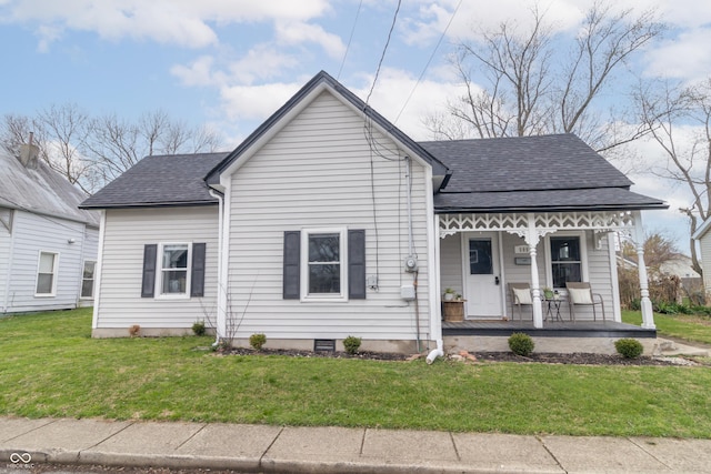 view of front of home featuring a front yard, a porch, and roof with shingles