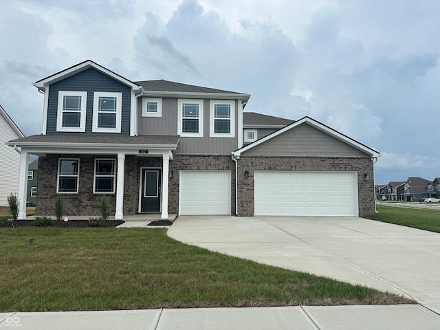 240 Ames Dr, Whiteland, IN 46184 - view of front of home featuring concrete driveway, a front lawn, and brick siding