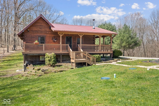 6351 Dixon Rd, Columbus, IN 47201 - log-style house featuring stairway, metal roof, log exterior, and a front lawn