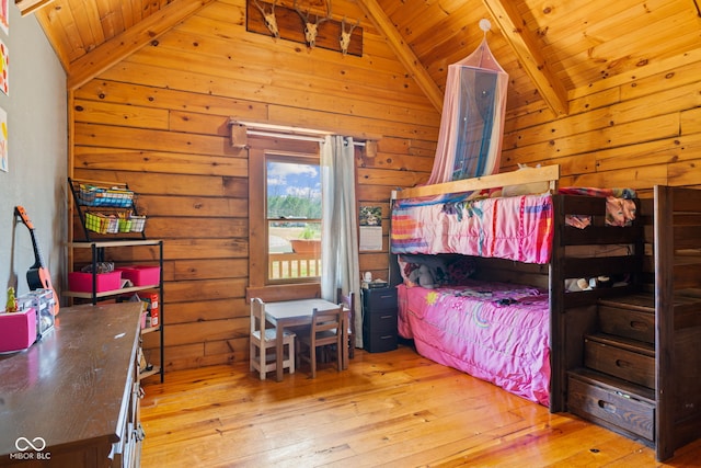 6351 Dixon Rd, Columbus, IN 47201 - bedroom featuring wood walls, light wood finished floors, and lofted ceiling with beams