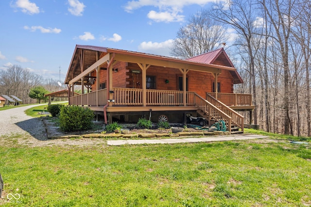 6351 Dixon Rd, Columbus, IN 47201 - view of front facade with a porch, metal roof, a front lawn, and stairs