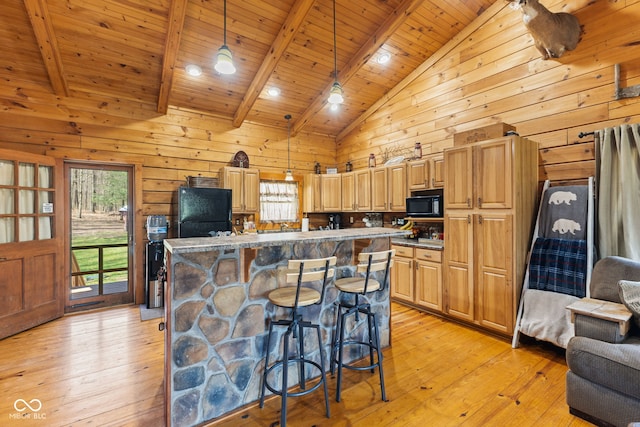 6351 Dixon Rd, Columbus, IN 47201 - kitchen with light wood-type flooring, wood walls, beam ceiling, wood ceiling, and black appliances