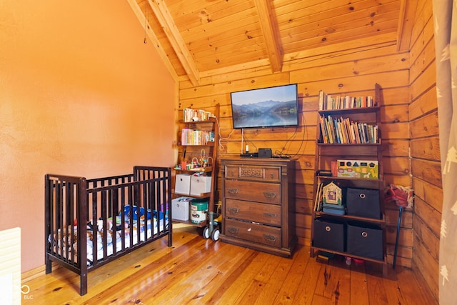 6351 Dixon Rd, Columbus, IN 47201 - bedroom with wooden ceiling, wood walls, vaulted ceiling with beams, and hardwood / wood-style flooring