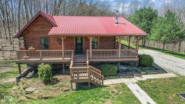 6351 Dixon Rd, Columbus, IN 47201 - view of front of house with stairway, metal roof, covered porch, and log exterior