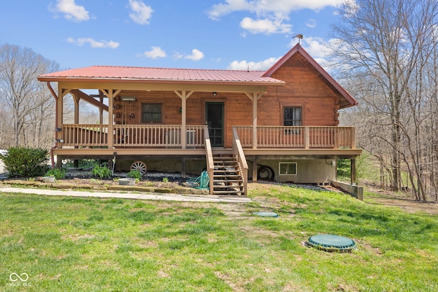 6351 Dixon Rd, Columbus, IN 47201 - view of front facade featuring metal roof, a front yard, and stairway