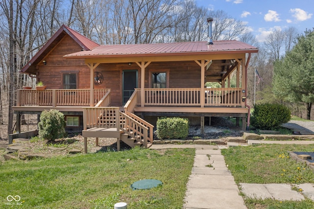 6351 Dixon Rd, Columbus, IN 47201 - view of front facade featuring metal roof, a front lawn, and stairway