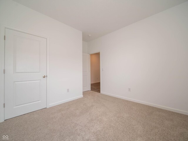 915 Saddlebrook Farms Blvd, Whiteland, IN 46184 - unfurnished bedroom with light colored carpet and baseboards