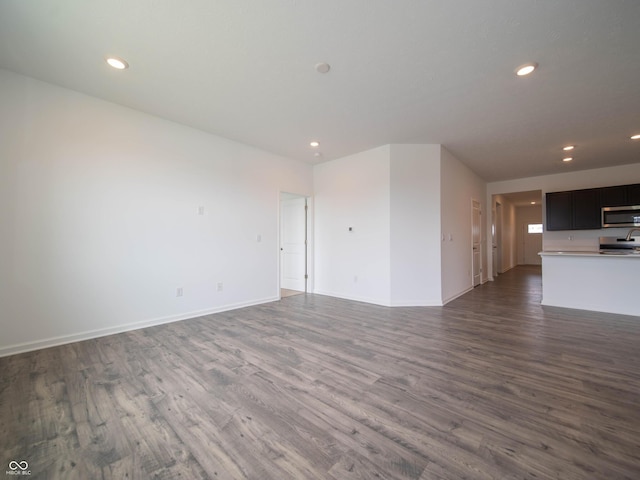 915 Saddlebrook Farms Blvd, Whiteland, IN 46184 - unfurnished living room with dark wood-style floors and recessed lighting