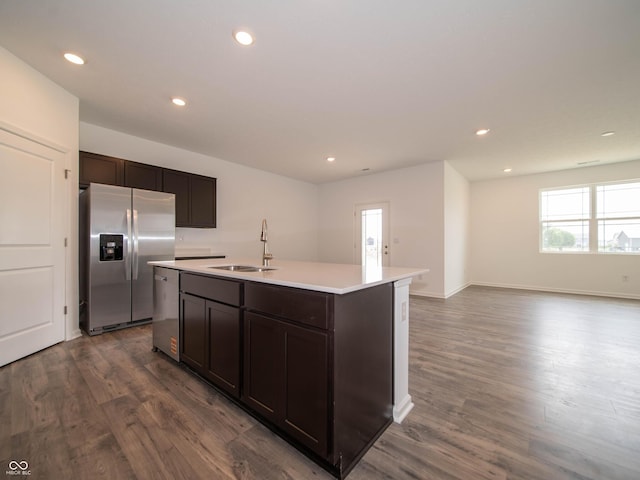 915 Saddlebrook Farms Blvd, Whiteland, IN 46184 - kitchen with appliances with stainless steel finishes, dark wood-style floors, dark brown cabinetry, an island with sink, and recessed lighting