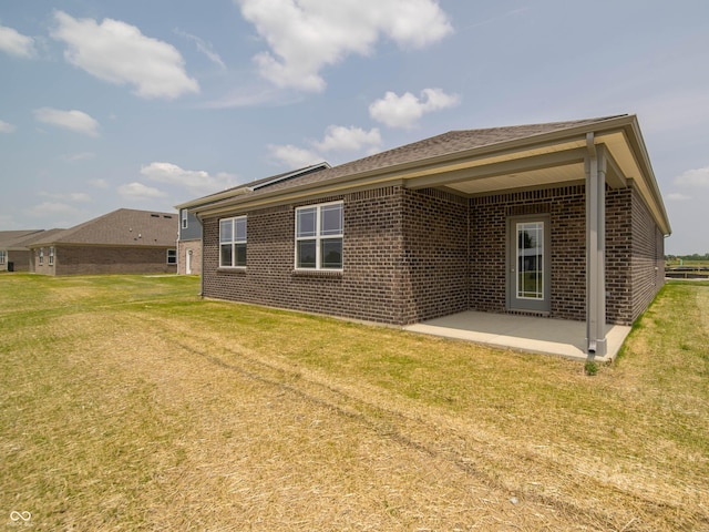 915 Saddlebrook Farms Blvd, Whiteland, IN 46184 - back of house featuring a patio area, brick siding, and a yard