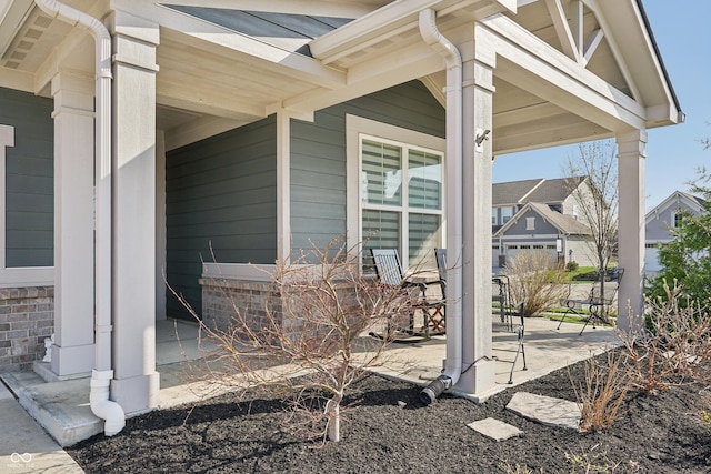 view of side of property featuring a porch