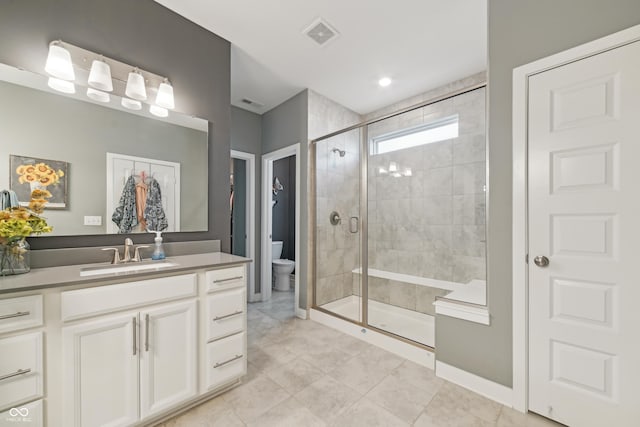 full bath with vanity, visible vents, toilet, and a shower stall