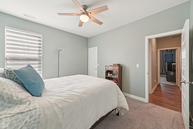 bedroom featuring baseboards, visible vents, ceiling fan, and carpet flooring