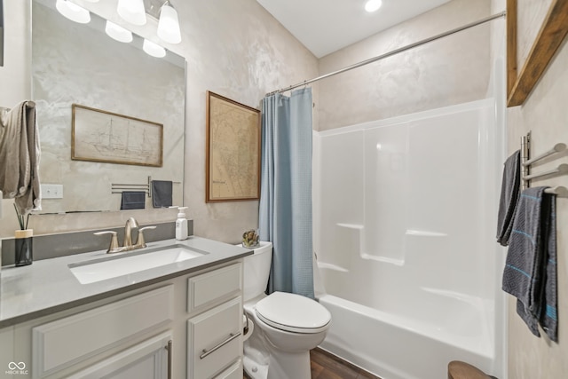 bathroom with shower / bath combination with curtain, toilet, and vanity