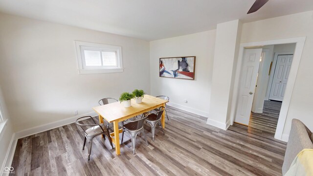 926 N Dearborn St, Indianapolis, IN 46201 - dining room featuring baseboards, ceiling fan, and wood finished floors