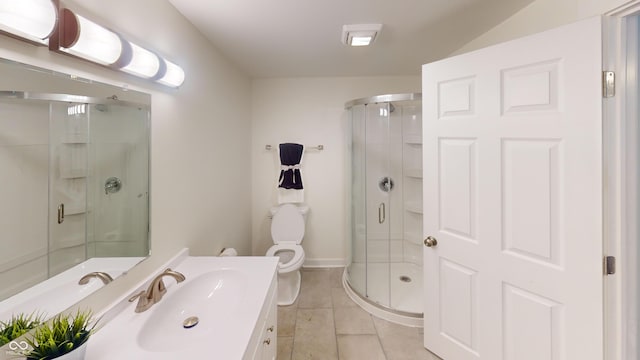 926 N Dearborn St, Indianapolis, IN 46201 - bathroom with a stall shower, tile patterned flooring, vanity, and toilet