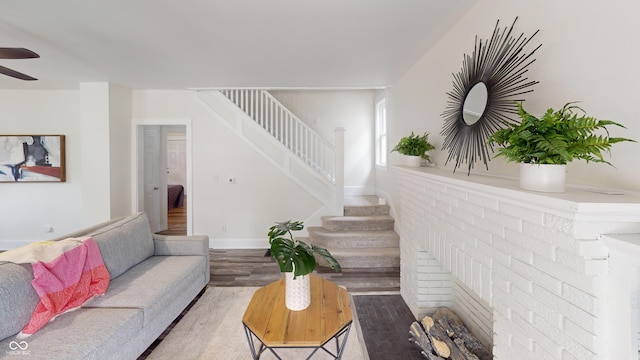 926 N Dearborn St, Indianapolis, IN 46201 - living room featuring light wood-style floors, ceiling fan, and stairs