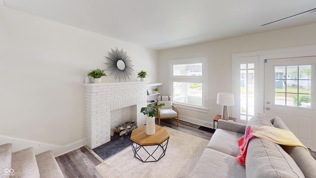926 N Dearborn St, Indianapolis, IN 46201 - living room with a fireplace, baseboards, and wood finished floors