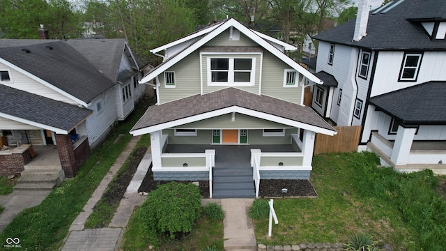 926 N Dearborn St, Indianapolis, IN 46201 - american foursquare style home with stairs, roof with shingles, covered porch, and fence