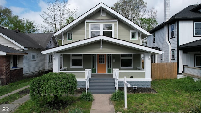 926 N Dearborn St, Indianapolis, IN 46201 - view of front of house with a porch and fence