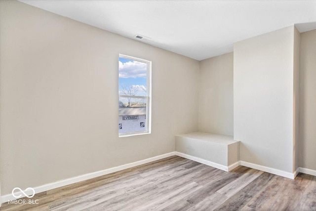 243 N Tacoma Ave, Indianapolis, IN 46201 - empty room with wood finished floors and baseboards