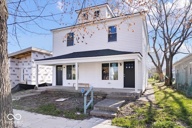 243 N Tacoma Ave, Indianapolis, IN 46201 - american foursquare style home featuring a porch