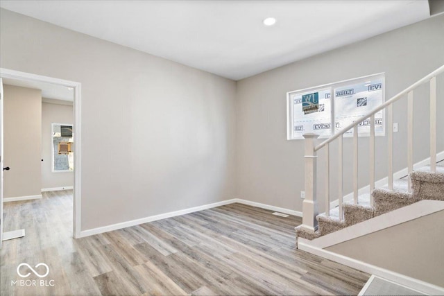 243 N Tacoma Ave, Indianapolis, IN 46201 - interior space with stairway, wood finished floors, baseboards, and recessed lighting