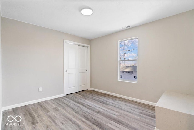 243 N Tacoma Ave, Indianapolis, IN 46201 - spare room with wood finished floors and baseboards