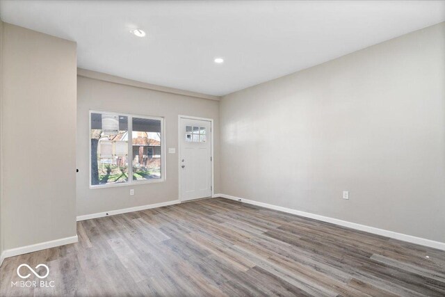 243 N Tacoma Ave, Indianapolis, IN 46201 - spare room featuring wood finished floors, baseboards, and recessed lighting
