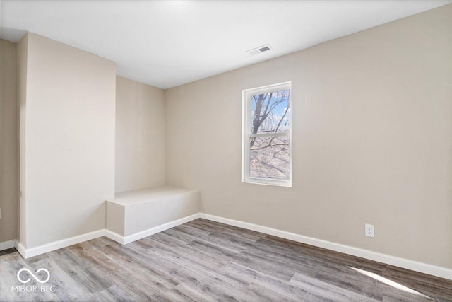 243 N Tacoma Ave, Indianapolis, IN 46201 - spare room with wood finished floors and baseboards