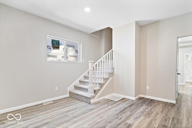243 N Tacoma Ave, Indianapolis, IN 46201 - stairs with wood finished floors, baseboards, and recessed lighting
