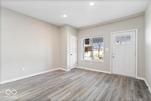 243 N Tacoma Ave, Indianapolis, IN 46201 - entrance foyer with wood finished floors, baseboards, and recessed lighting