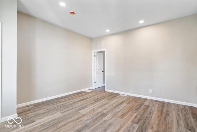 243 N Tacoma Ave, Indianapolis, IN 46201 - spare room featuring wood finished floors, baseboards, and recessed lighting