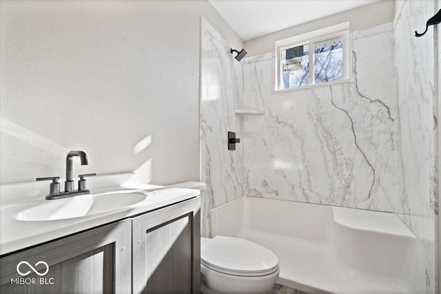 243 N Tacoma Ave, Indianapolis, IN 46201 - bathroom featuring a shower, toilet, and vanity