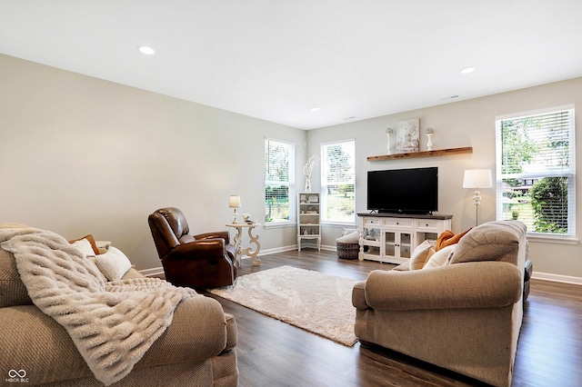 living room featuring recessed lighting, baseboards, and dark wood finished floors