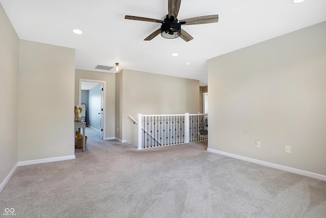 empty room featuring recessed lighting, carpet, baseboards, visible vents, and a ceiling fan