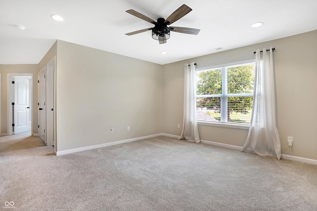 spare room with light colored carpet, baseboards, visible vents, ceiling fan, and recessed lighting
