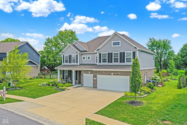 traditional home with a garage, a front yard, brick siding, roof with shingles, and driveway