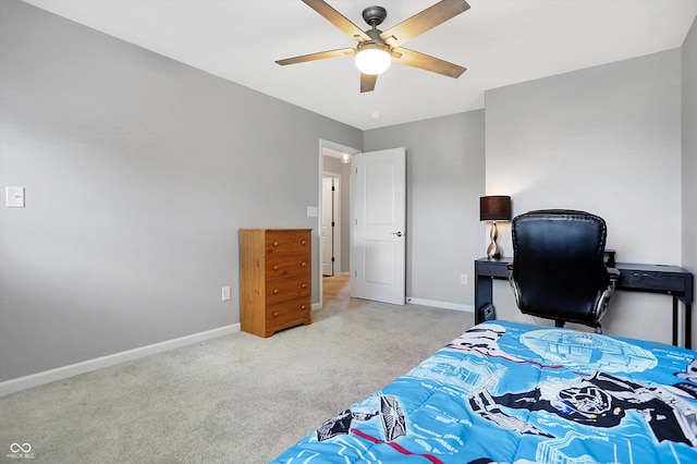 bedroom with baseboards, a ceiling fan, and light carpet
