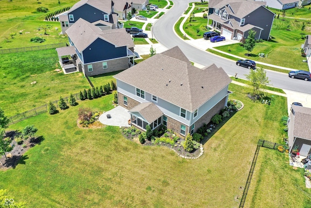 birds eye view of property with a residential view